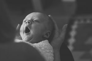 newborn shoot of an infant yawning